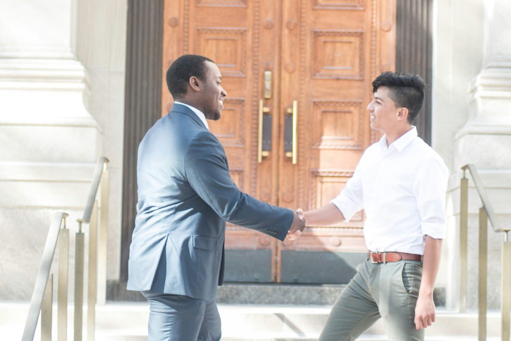 West Michigan homeowner and direct buyer shaking hands after a home sale agreement
